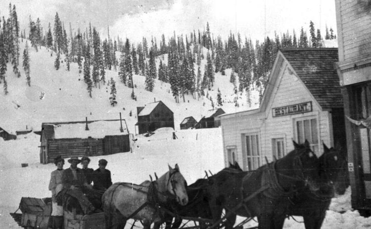 The mail sled at Red Mountain, with Art Stewart the driver in an undated photo, delivering mail and passengers. Photo courtesy of San Juan County Historical Society