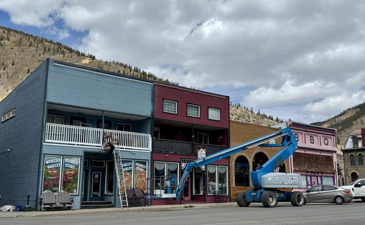 Harley store building on Greene St being painted before summer season