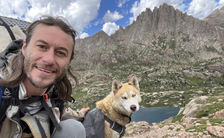Brady Snow and is Dog Katana on Jagged Mountain in the Needle Mountains. Photo by Brady Snow