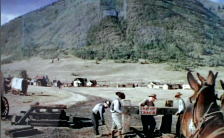 In this image from the movie “A Ticket to Tomahawk” railroad workers remove the “End of Track” sign as a 20-mule team begins to pull the Emma Sweeney locomotive out of Epitaph, Colo., to Tomahawk. The scene was shot in the summer of 1949, where the old Silverton, Gladstone &amp; Northerly Railroad split from the Denver &amp; Rio Grand tracks, near the present intersection of Cement and 12th streets.
