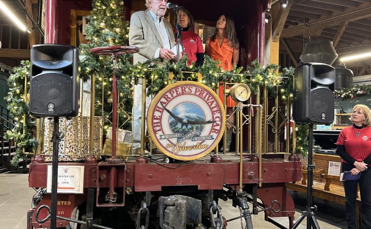 (L to R)- Richard Ballantine owner of Durango Herald, Former Senator Ellen Roberts and former Mayor of Durango Christine Renderlie present to crowd off of Al Harper’s private car parked in the DSNGRR Museum. Photo credit DeAnne Gallegos
