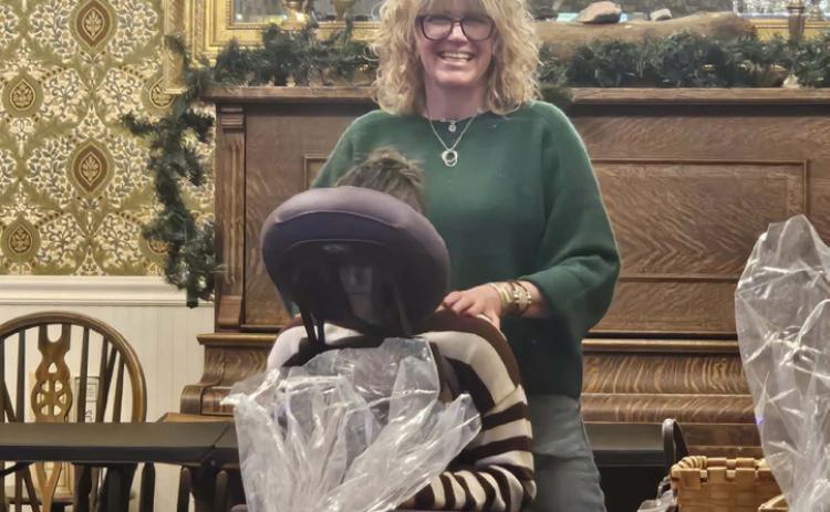 Local massage therapist Cara Pellowski had a massage chair at the event photo by Haley Jones