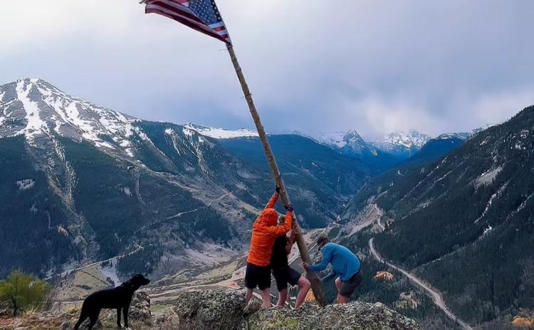 Thomas Moore On Memorial Day three locals Thomas Moore, Reid Kalmus, and Joe Lindberg put the flag and tree pole back up on Anvil Mountain overlooking Silverton.
