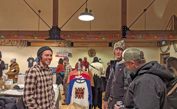 Photo credit Silverton Creative District Julian Hood with his screen-printed tees at the Mistletoe Market.