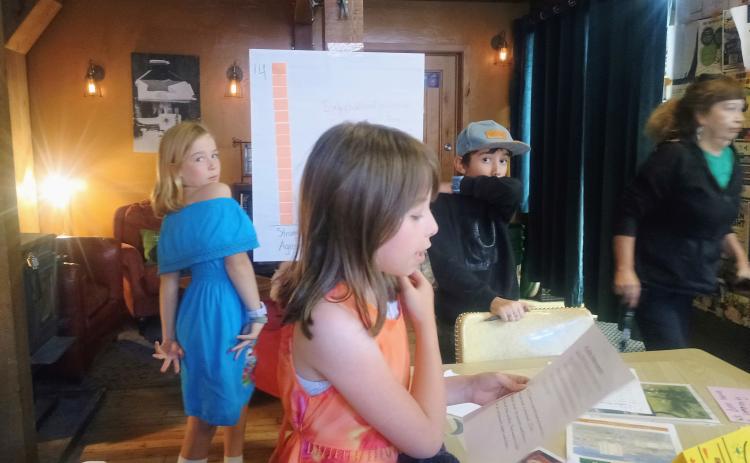 Silverton School kids Maxine and Anyela help the Silverton Family Learning Center present information at the Coffee Bear open house Photo by Megan Brosh