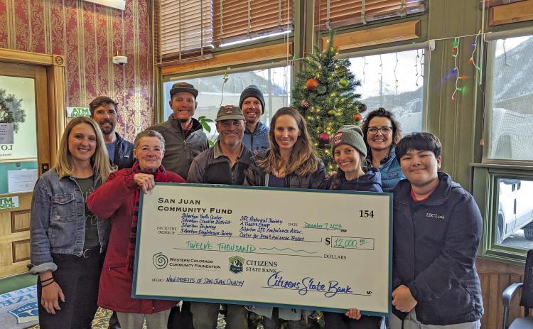 The recipients of the San Juan County Community Fund get a giant check!