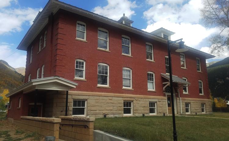 This photograph from the south shows the completed work on the building including the new handicap entrance and ramp on the Bluff Street end of the building.