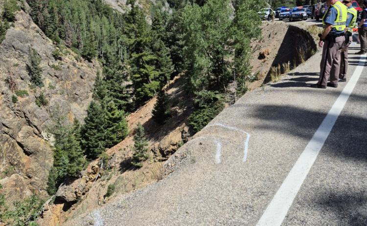 Aug 5th fatal accident photo shows CSP chalk lines of tires going over edge while trying to turn around on highway 550. Photo by CSP