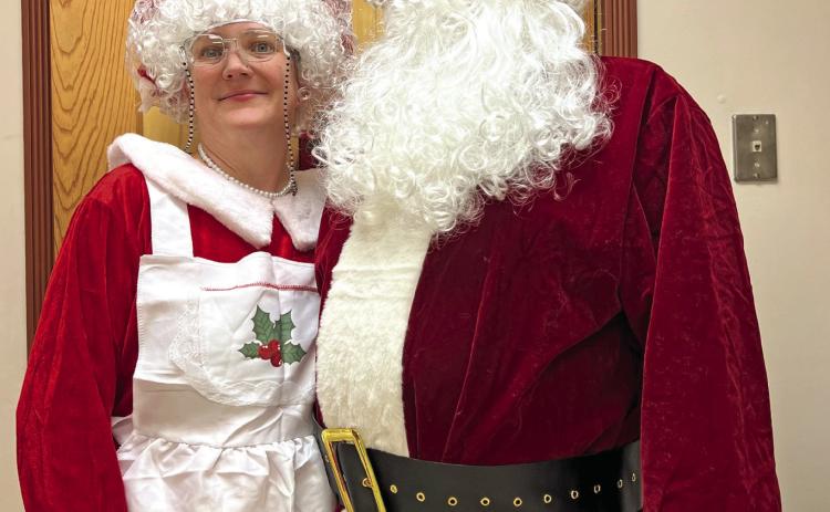 Mr. and Mrs. Claus were in attendance at the annual holiday potluck. Photo credit DeAnne Gallegos