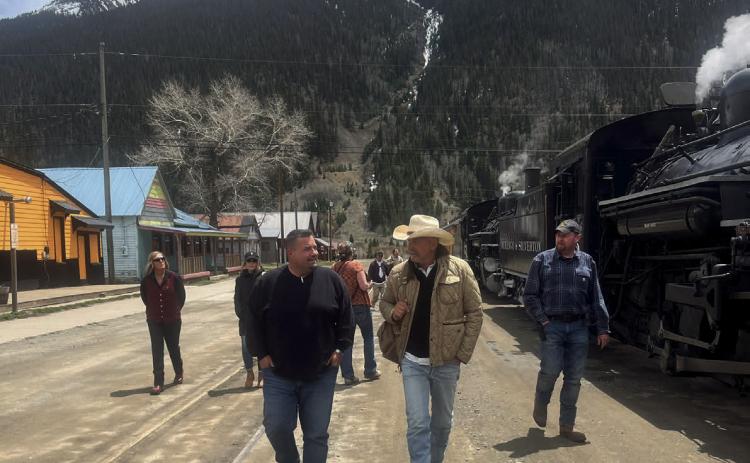 Celebrity Kevin Costner and local Jim Harper in front of the train.