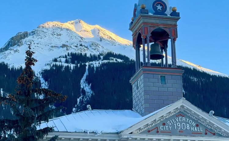 Town Hall at sunset Monday evening had a clear blue sky above it. Below zero frigid temps settled in that night. Photo credit DeAnne Gallegos