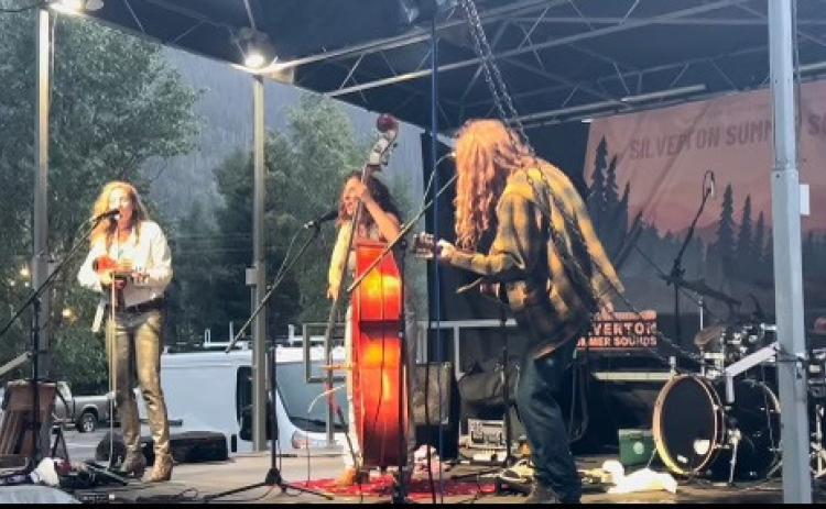 Sweet Lillies play in the rain during Silverton Summer Sounds. Photo credit DeAnne Gallegos