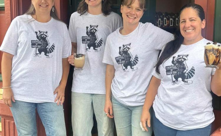 In light of all the “trash drama,” Elevated Coffee Shop in the Grand Imperial Hotel is making a drink out of it. The “Trash Panda” was presented on a social media post by coffee shop owner Melanie Barger on the far left. Timberline Trading Co. across the street designed the t-shirt that is for sale in their shop.