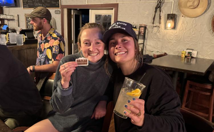 photo by Sarah Moore Silverton locals Natalie Platt &amp; Lucy Mulvihil celebrate with SJDA with a party thrown at the El Bandito by showing off the new sticker featuring the sign.