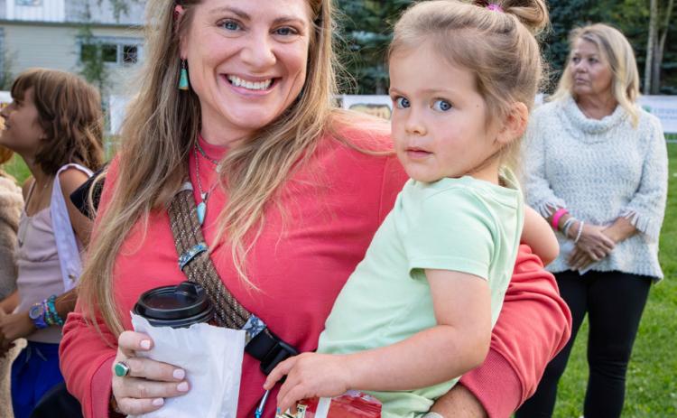 Leah Ham and her daughter having a good time at the arts festival photo by Cracked Compass