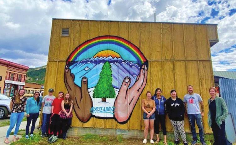 Students Stand in Front of Finished Mural. Photo Credit | SJCPH